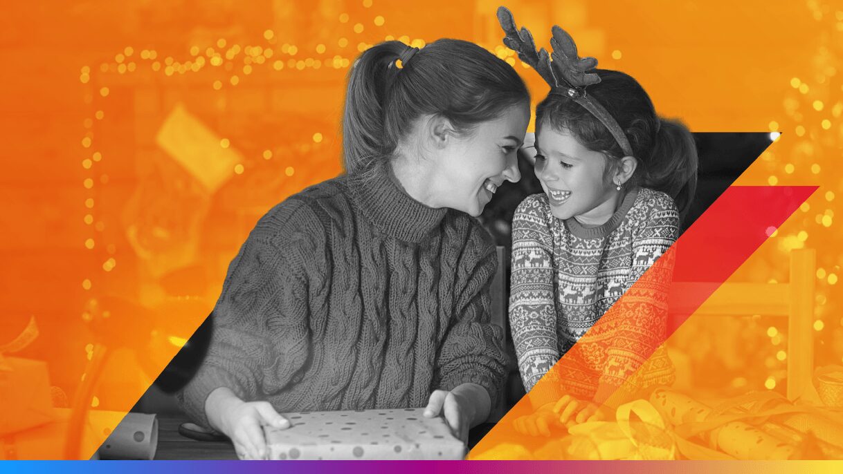 image of parent with kid opening christmas presents - featured image for 12 holiday marketing trends article